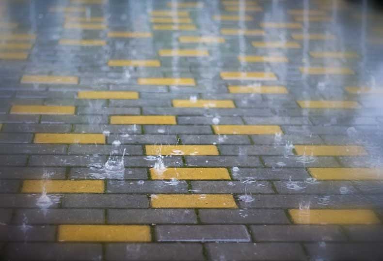 Laying Tiles in The Rain